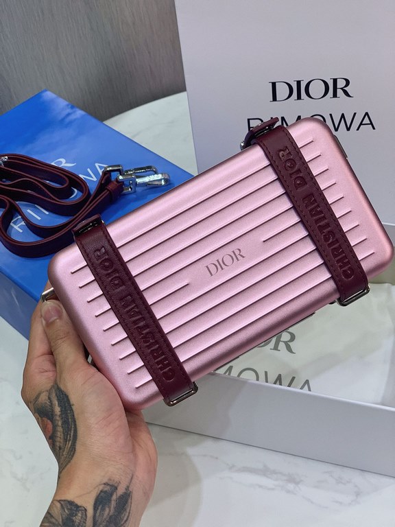 DIR X RIMOWA Capsule Collaboration CollectionUltra Limited EditionA lot of goodwill  My heart  Small but very  lovely. Super practical,Total  3 compartments. The size of a handbag.It can definitely fit an Iphone proMax [