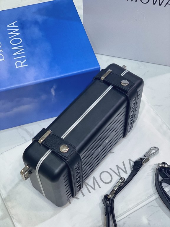 DIR X RIMOWA Capsule Collaboration CollectionUltra Limited EditionA lot of goodwill  My heart  Small but very  lovely. Super practical,Total  3 compartments. The size of a handbag.It can definitely fit an Iphone proMax [