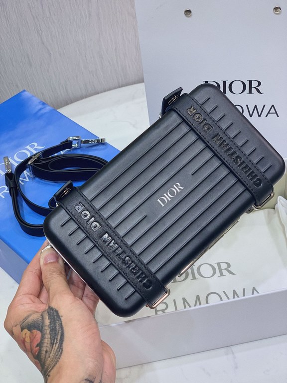 DIR X RIMOWA Capsule Collaboration CollectionUltra Limited EditionA lot of goodwill  My heart  Small but very  lovely. Super practical,Total  3 compartments. The size of a handbag.It can definitely fit an Iphone proMax [