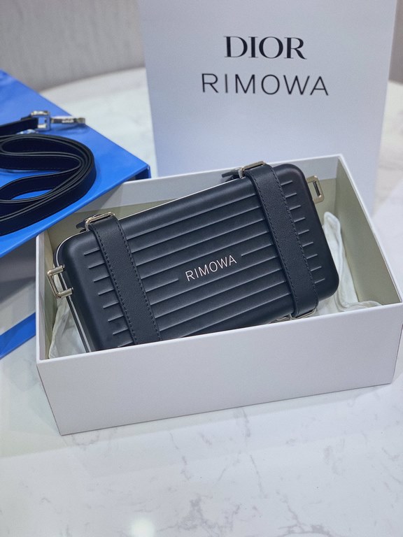 DIR X RIMOWA Capsule Collaboration CollectionUltra Limited EditionA lot of goodwill  My heart  Small but very  lovely. Super practical,Total  3 compartments. The size of a handbag.It can definitely fit an Iphone proMax [