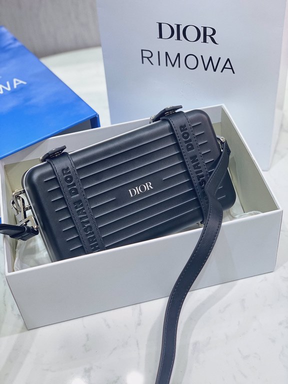 DIR X RIMOWA Capsule Collaboration CollectionUltra Limited EditionA lot of goodwill  My heart  Small but very  lovely. Super practical,Total  3 compartments. The size of a handbag.It can definitely fit an Iphone proMax [