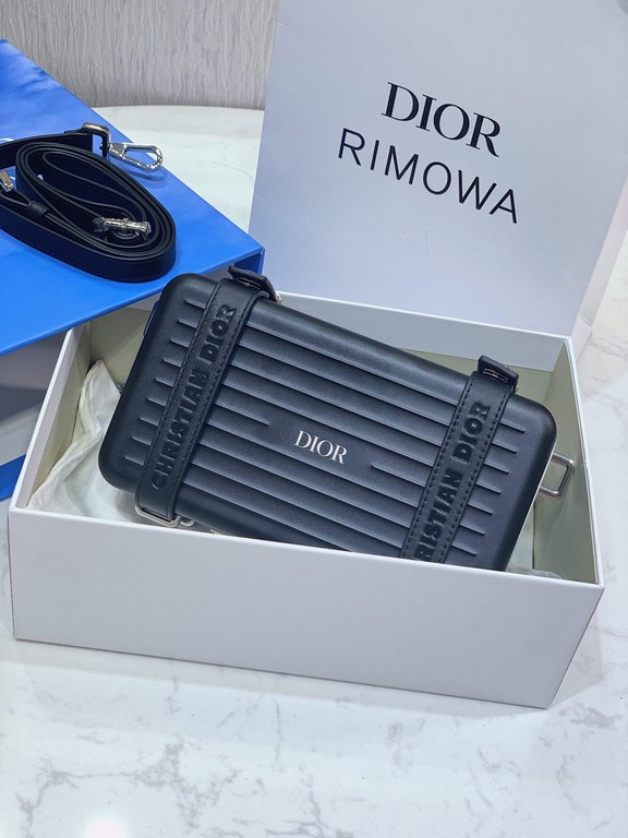 DIR X RIMOWA Capsule Collaboration CollectionUltra Limited EditionA lot of goodwill  My heart  Small but very  lovely. Super practical,Total  3 compartments. The size of a handbag.It can definitely fit an Iphone proMax [