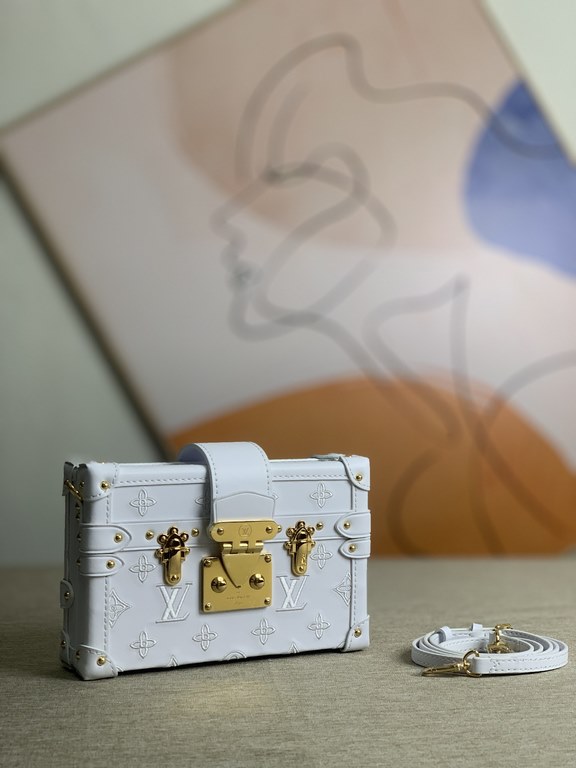 M20847] This Petite Malle bag is crafted from cowhide leather and features the classic Monogram motif in fine cuts, with bourdon stitching to close the silhouette, making it even more refined than Nicolas Ghesquière's po