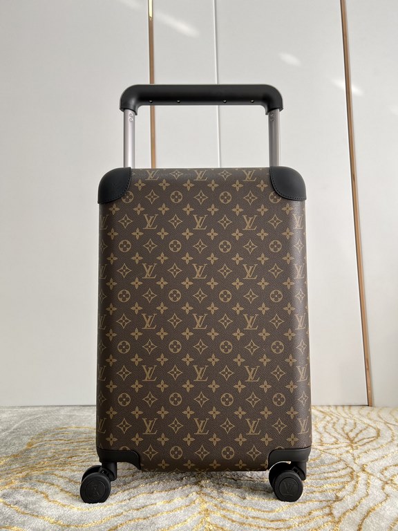 EXCLUSIVE PHOTO The new Horizon luggage revolutionizes Louis Vuitton's legendary heritage with a creative twist. The iconic Monogram canvas is embellished with travel appliqués that harken back to the brand's heritage of