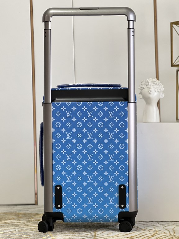 The new Horizon luggage revolutionizes Louis Vuitton's legacy with a creative twist. The iconic Monogram canvas is embellished with travel appliqués that harken back to the brand's heritage of luggage design. Leather cor