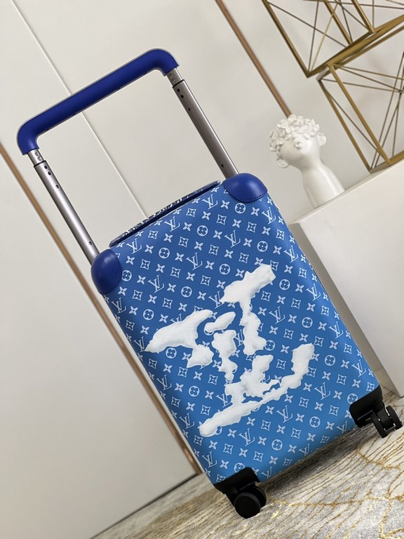 The new Horizon luggage revolutionizes Louis Vuitton's legacy with a creative twist. The iconic Monogram canvas is embellished with travel appliqués that harken back to the brand's heritage of luggage design. Leather cor