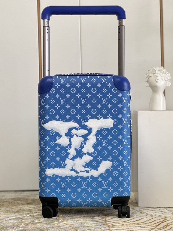 The new Horizon luggage revolutionizes Louis Vuitton's legacy with a creative twist. The iconic Monogram canvas is embellished with travel appliqués that harken back to the brand's heritage of luggage design. Leather cor