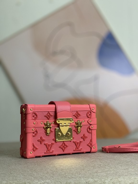 Exclusive M20745 Embroidered in solid steel, this Petite Malle bag is crafted from tufted grained cowhide and embroidered with a Monogram pattern. The stitching is carefully controlled to create a velvety smooth texture,