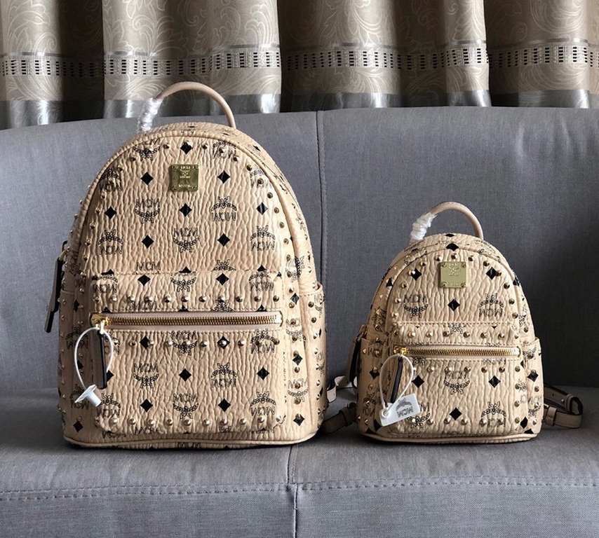 Code 5917-5718-5919. [MCM] Stark Visetos studded duffel bag in a classic Visetos print with metal rivets outlining the print. Crafted from lightweight bond-coated canvas and designed in a classic Visetos print, the pract