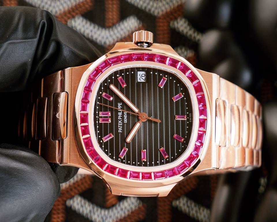 Patek Philippe 5711113P-01 Nautilus, the king of steel watches, is available in a limited edition. The octagonal square bezel is set with emerald and ruby baguettes of exceptional color. Horizontal cross-grained dial set