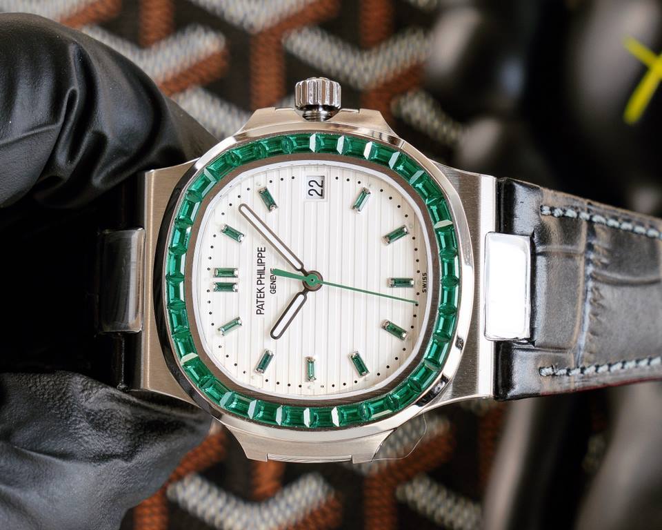 Patek Philippe 5711113P-01 Nautilus, the king of steel watches, is available in a limited edition. The octagonal square bezel is set with emerald and ruby baguettes of exceptional color. Horizontal cross-grained dial set