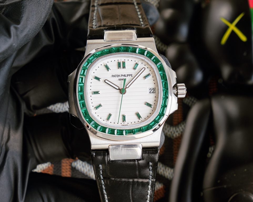 Patek Philippe 5711113P-01 Nautilus, the king of steel watches, is available in a limited edition. The octagonal square bezel is set with emerald and ruby baguettes of exceptional color. Horizontal cross-grained dial set