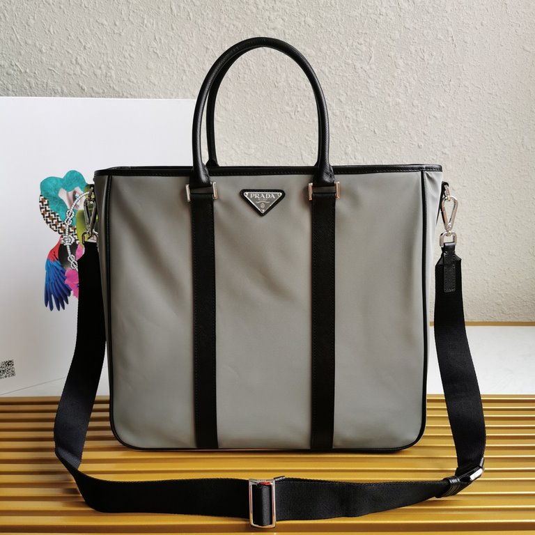 Made from a combination of imported nylon fabric and Saffiano cross grain cowhide leather, the handbag comes with a detachable shoulder strap to create a stylish look at your own pace. Simple and atmospheric, very practi