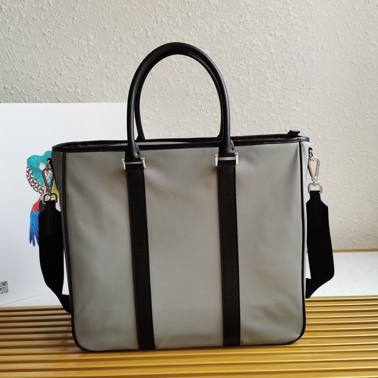 Made from a combination of imported nylon fabric and Saffiano cross grain cowhide leather, the handbag comes with a detachable shoulder strap to create a stylish look at your own pace. Simple and atmospheric, very practi