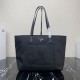 [Top Original]  New Tote Bag 1BG052  This traditional tote bag comes with a spacious front pocket and Saffiano leather carry handle. The distinctive triangular logo embellishment is a signature of the brand. Nylon was in