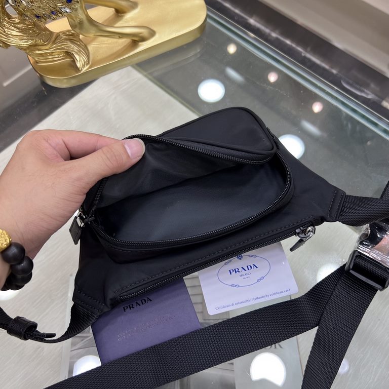 PRADA Prada New Belt Bag 2VH128   The summer collection combines technologically innovative fabrics with traditional materials. Clothing and accessories reveal innovative silhouettes that celebrate contradictory and oppo