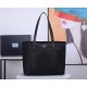 Lot   Tote Bag  1BG052    This nylon tote bag combines fashionable design and functionality with long Saffiano leather handles for a personalized touch, a two-way top zipper closure, a front exterior pocket, and two inte