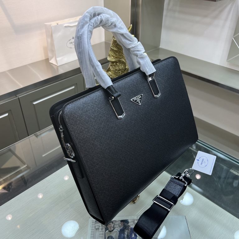 PRADA Prada New Briefcase Made of imported cowhide leather, top polished stainless steel finish metal accessories , front exterior triangular enamel logo, ring head with combination lock, simple and generous business Suc