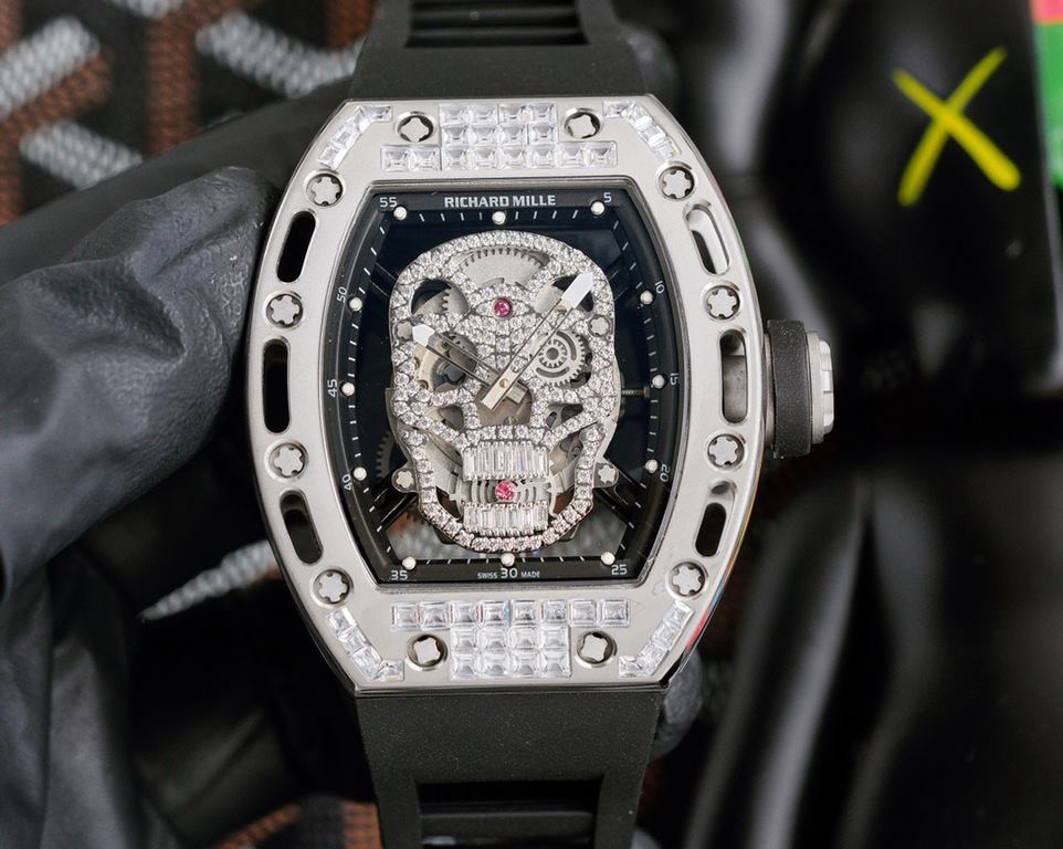 Richard Mille RM-052 The newest addition to the RM-052 collection, the skull and skeleton collection, with its diamond-encrusted case and original mechanical movement, highlights the sporty style of this watch. Its bold,