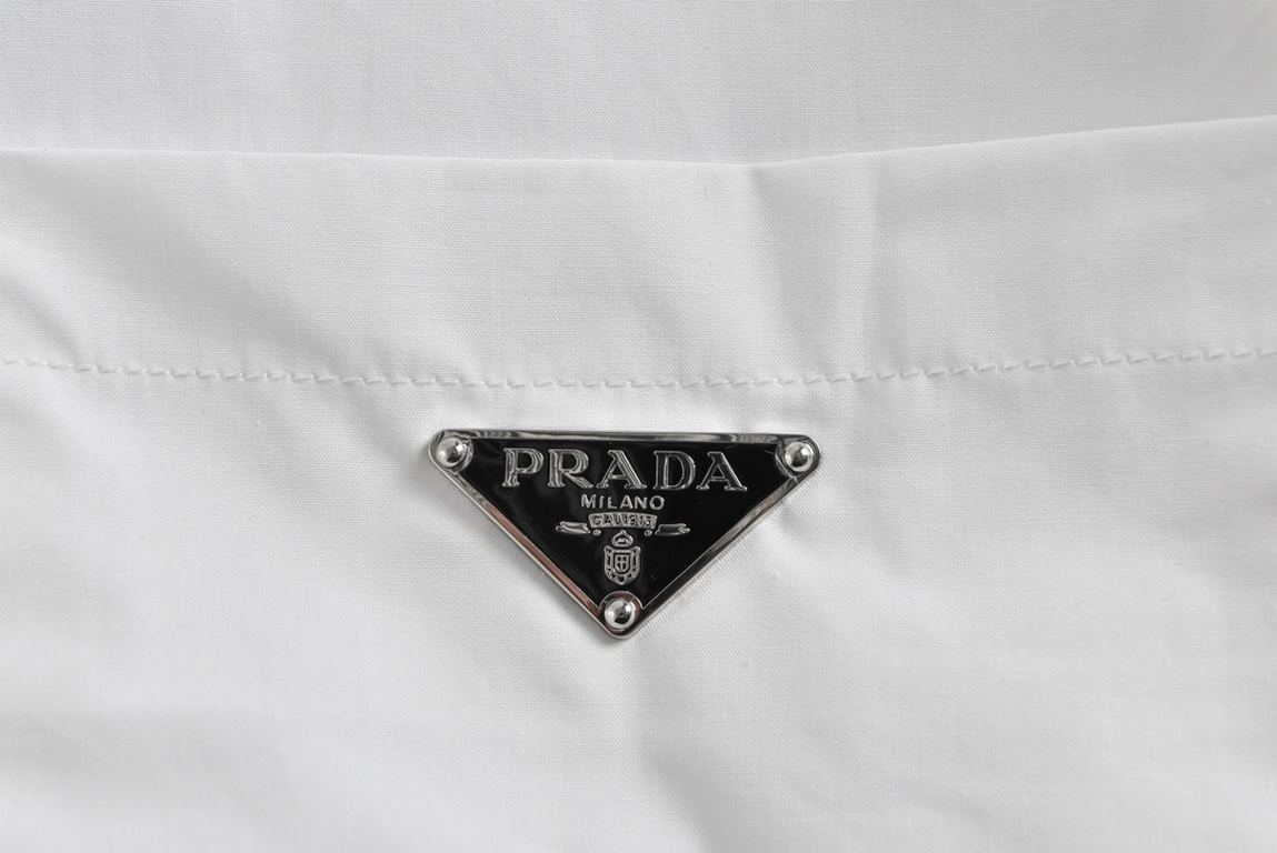 PRADA Prada Triangle Pocket Poplin Long Sleeve ShirtMade of superfine 60 count organic cotton high density poplin fabric (BCI Swiss certified), collarkevlarplacket with 75D knitted viscose lining, customized iconic silve