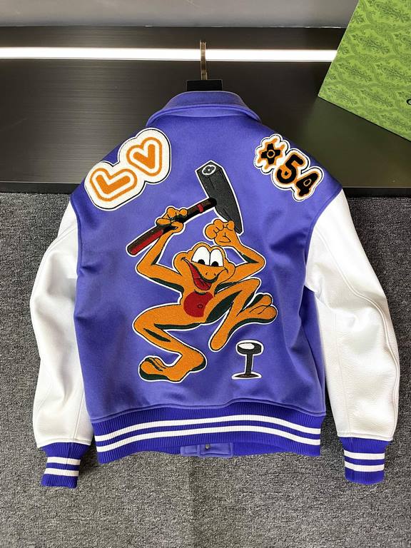 The Baseball Belted Jacket is made from LWG certified grained cowhide leather with an Australian wool body, embroidered appliqués with a colorful logo, a shirt collar, threaded sheep's wool cuffs, and a voluminous hemlin