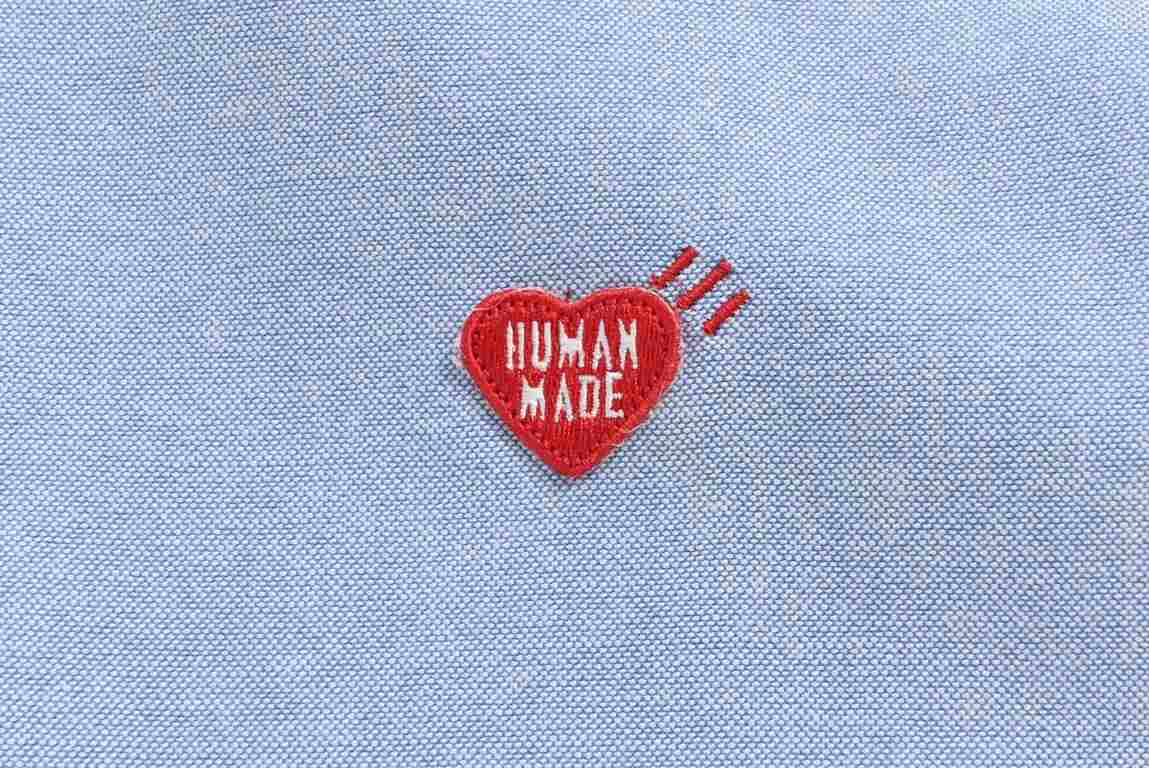 Human Made Heart Embroidered Oxford Long Sleeve ShirtThis shirt features a heart embroidered on the chest in bold red thread and the slogan Gears For Futuristic Teenagers embroidered in the same color directly below. Tai