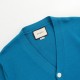 P245 Product Details.This blue V-neck cardigan is crafted from cashmere. The textured sweater shape lends a modern twist to the traditional silhouette, while the small Gucci horsebit embroidery is an understated nod to t