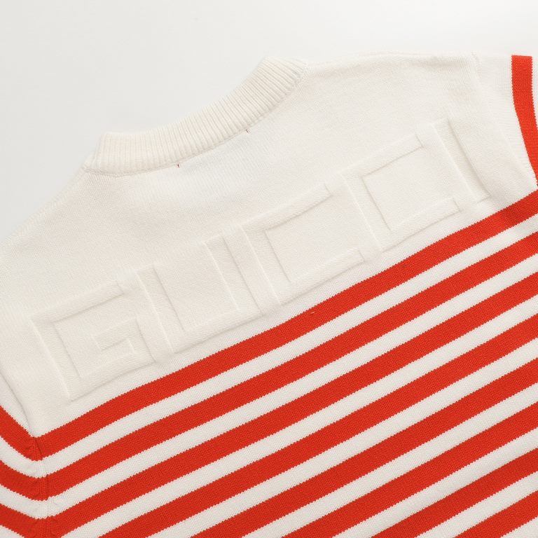 P220 Product DetailsTraditional motifs are reinterpreted through the Gucci aesthetic in a series of classic knitwear pieces. Crafted from jersey cotton, this sweater is brightened with red and ivory stripes. A Gucci appl