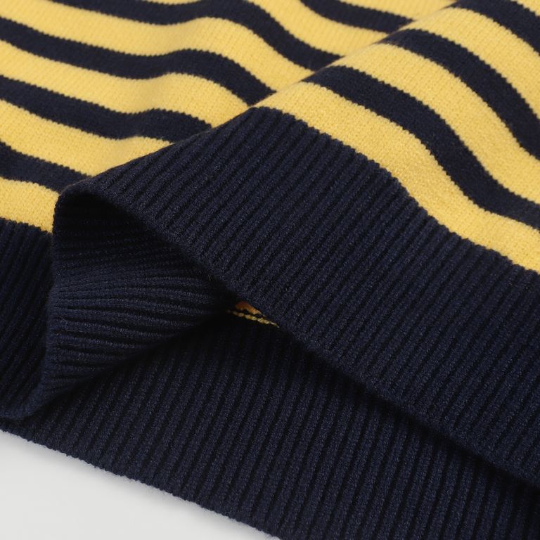 P220 Traditional motifs are reinterpreted through the Gucci aesthetic in a series of classic knitwear pieces. This sweater is crafted from jersey cotton and features bright blue and yellow stripes. The back is embellishe