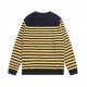 P220 Traditional motifs are reinterpreted through the Gucci aesthetic in a series of classic knitwear pieces. This sweater is crafted from jersey cotton and features bright blue and yellow stripes. The back is embellishe