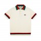 Gucci 2024SS New Chest Double G Knit Lapel Short Sleeve Polo ShirtIvory cotton jersey, red and blue appliqués, interlocking double G embroidered appliqués, webbed lapel, button front, dolman sleeves, ribbed edgingIvory, 