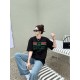 Gucci Gucci Logo Oversized Stylized Embroidered Short Sleeve T-Shirt with Interlocking Buttons-Model's Image