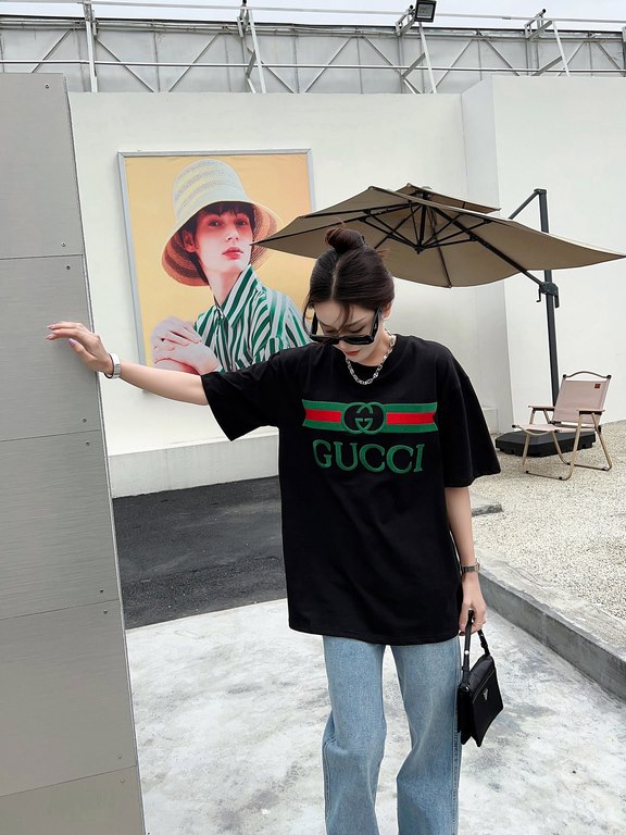 Gucci Gucci Logo Oversized Stylized Embroidered Short Sleeve T-Shirt with Interlocking Buttons-Model's Image