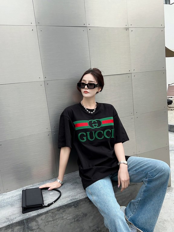 Gucci Gucci Logo Oversized Stylized Embroidered Short Sleeve T-Shirt with Interlocking Buttons-Model's Image