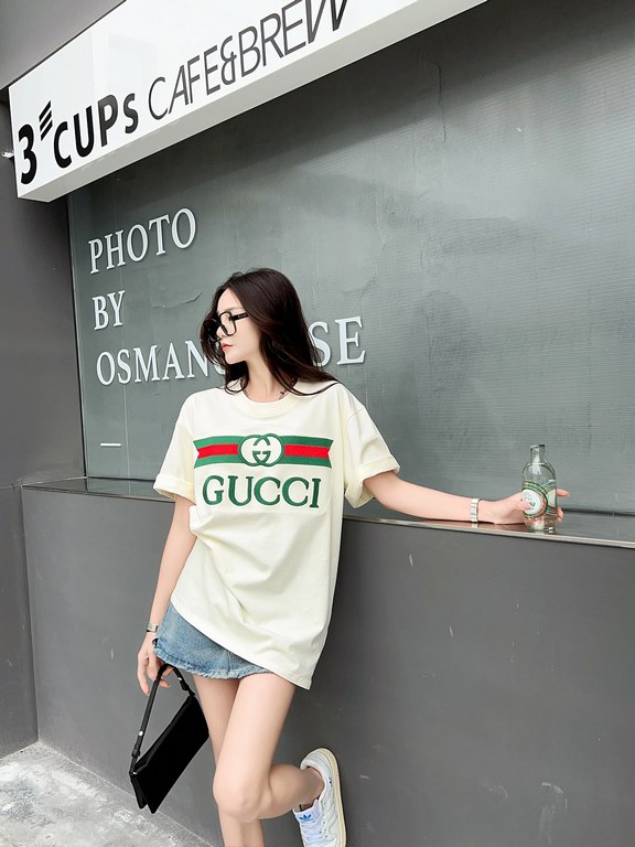 Gucci Gucci Logo Oversized Stylized Embroidered Short Sleeve T-Shirt with Interlocking Buttons-Model's Image