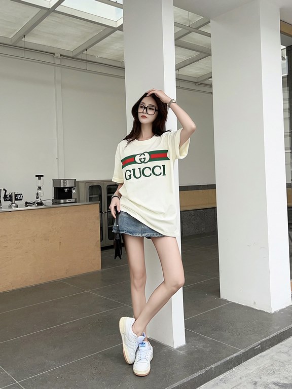 Gucci Gucci Logo Oversized Stylized Embroidered Short Sleeve T-Shirt with Interlocking Buttons-Model's Image