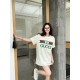 Gucci Gucci Logo Oversized Stylized Embroidered Short Sleeve T-Shirt with Interlocking Buttons-Model's Image