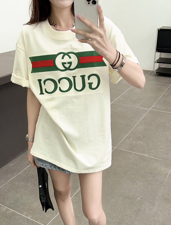 Gucci Gucci Logo Oversized Stylized Embroidered Short Sleeve T-Shirt with Interlocking Buttons-Model's Image