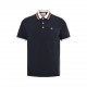 The Gucci Classic Pocket Double G Embroidered Polo Short SleeveGucci Classic Pocket Double G Embroidered Polo Short Sleeve The brand's iconic motifs are subtly blended with textural and embellishment detailing for the re