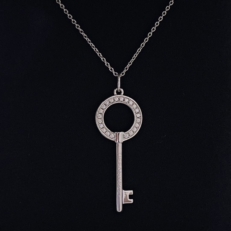 T Chinese Knot Round Openwork Keys   NecklaceLike a beacon of light guiding people to optimism and hope, the T Keys symbolize light and the future. The smooth lines of this key are designed to dazzle. Geometric lines are