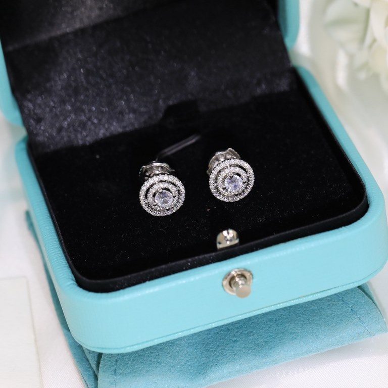 Tiffany Tiffany Stud Earrings Diamond studs in S925 sterling silver with saucer ear buds plated in white gold  .