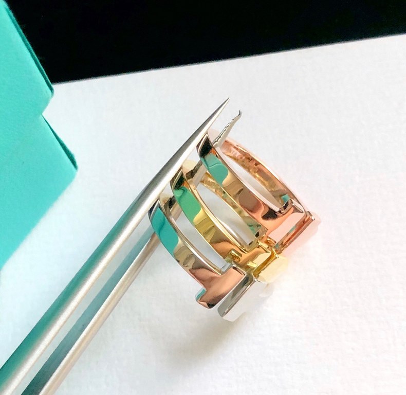 tiff Tiffany Original Smiley   Polished Wide   Twin T Ring The letter T is strong, bold and powerful in its lines. Natalie personalizes the #ModernT era with the attitude-packed Tiffany T Two ring.   High-end Original ma