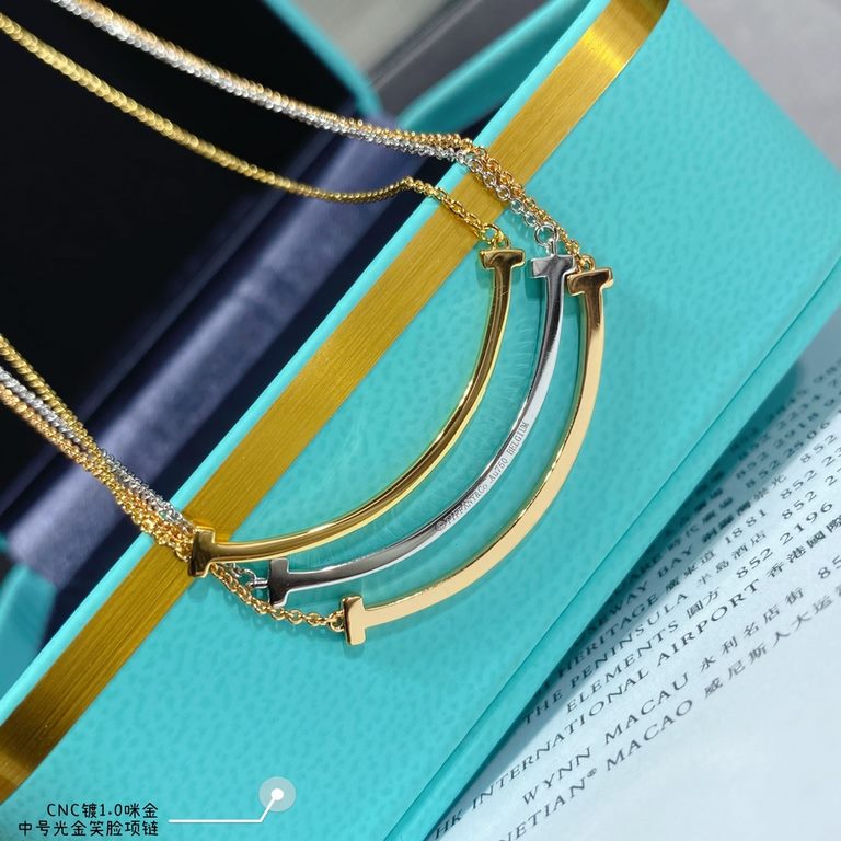 V gold material Tiff    counter Latest Double T  Smile  Tiffany medium light gold smiley necklace  11 heavy work tiffany with a smiley face the strongest inspiration for the design, the smile is one of the most beautiful