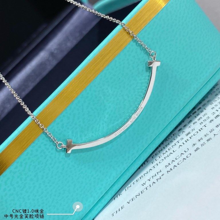 V gold material Tiff    counter Latest Double T  Smile  Tiffany medium light gold smiley necklace  11 heavy work tiffany with a smiley face the strongest inspiration for the design, the smile is one of the most beautiful