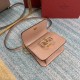 Small   model BOXValentino Garavani VSLING Shiny calf leather shoulder bag   with extendable shoulder strap for shoulder and crossbody use. Vintage brass-finished metal hardware Magnetic closure with leather-covered logo