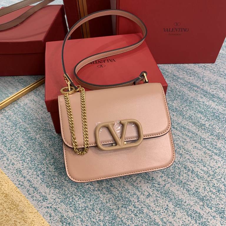 Small   model BOXValentino Garavani VSLING Shiny calf leather shoulder bag   with extendable shoulder strap for shoulder and crossbody use. Vintage brass-finished metal hardware Magnetic closure with leather-covered logo