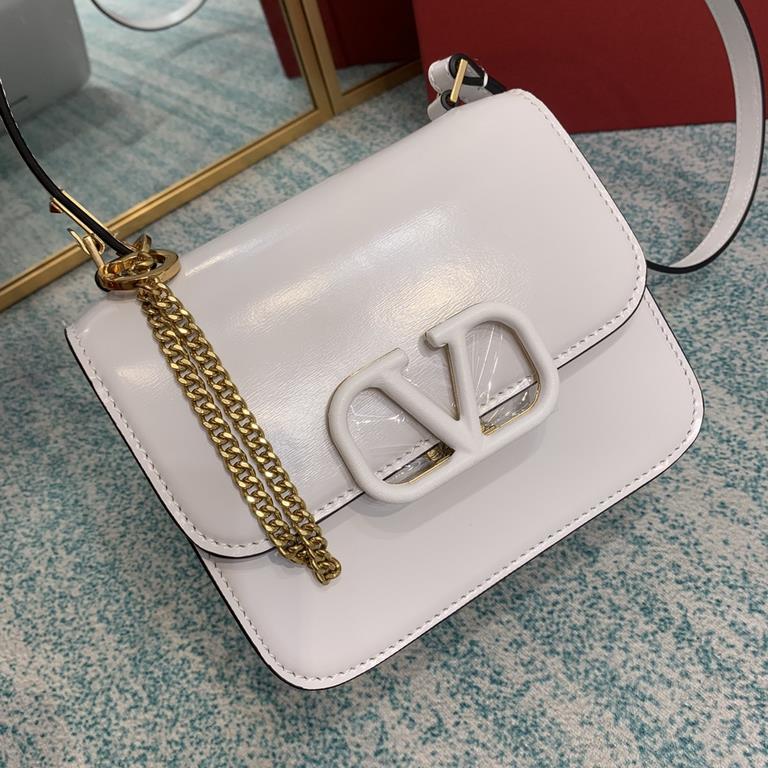 Small   Model BOXValentino Garavani VSLING Shiny calf leather shoulder bag   with extendable shoulder strap for shoulder and crossbody use. Vintage brass-finished metal hardware Magnetic closure with leather-covered logo