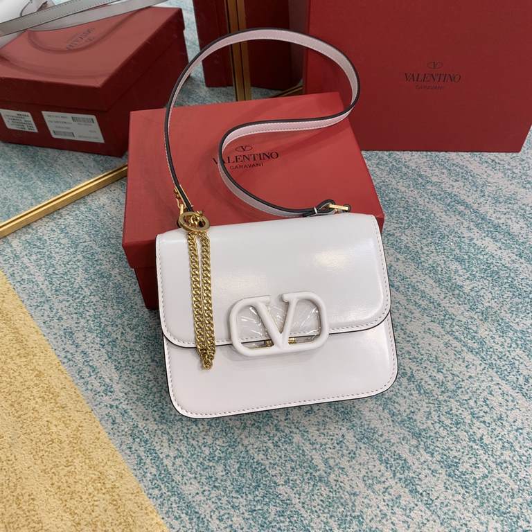 Small   Model BOXValentino Garavani VSLING Shiny calf leather shoulder bag   with extendable shoulder strap for shoulder and crossbody use. Vintage brass-finished metal hardware Magnetic closure with leather-covered logo