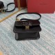 Small black buckle   model BOXValentino Garavani VSLING Shiny calf leather shoulder bag   with extendable shoulder strap for shoulder and crossbody use. Vintage brass-finished metal hardware Magnetic closure with leather