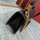 Small black buckle   model BOXValentino Garavani VSLING Shiny calf leather shoulder bag   with extendable shoulder strap for shoulder and crossbody use. Vintage brass-finished metal hardware Magnetic closure with leather